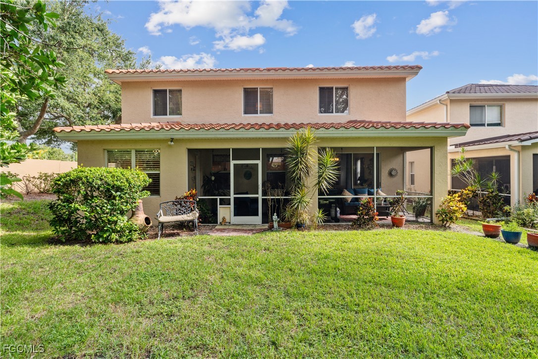 9475 Silver Pine Loop Fort Myers, FL 33967 - Photo 3 of 34 a view of a house with sitting area and garden