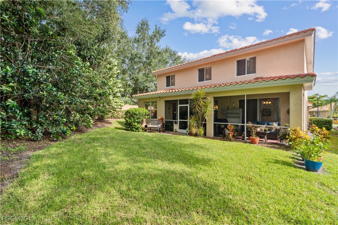9475 Silver Pine Loop Fort Myers, FL 33967 - Photo 32 of 34 a view of a house with a yard porch and sitting area
