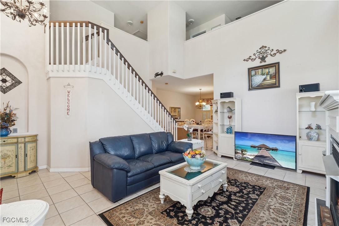 9475 Silver Pine Loop Fort Myers, FL 33967 - Photo 6 of 34 a living room with furniture and a rug