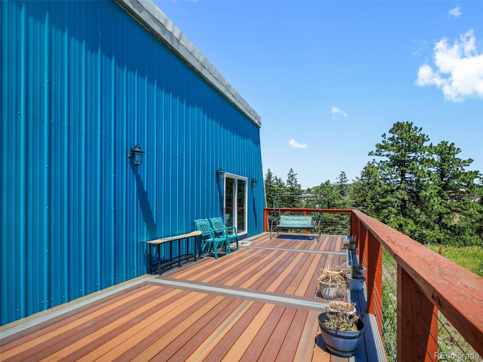 1044 South Grapevine Road Golden, CO 80401 - Photo 34 of 47 a view of balcony with wooden floor and outdoor seating
