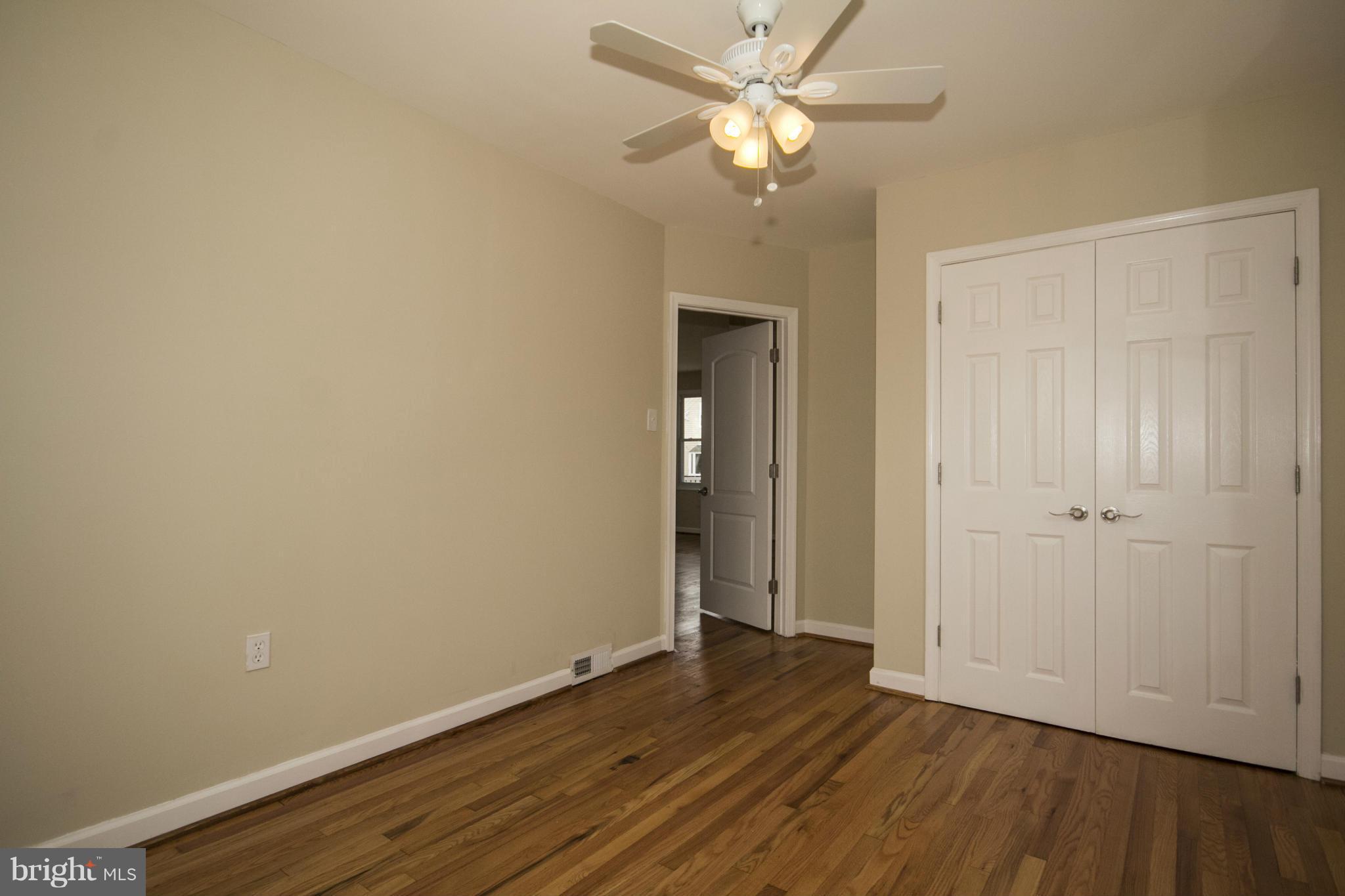 1220 Willow Road Baltimore, MD 21222 - Photo 17 of 23 a view of an empty room with wooden floor