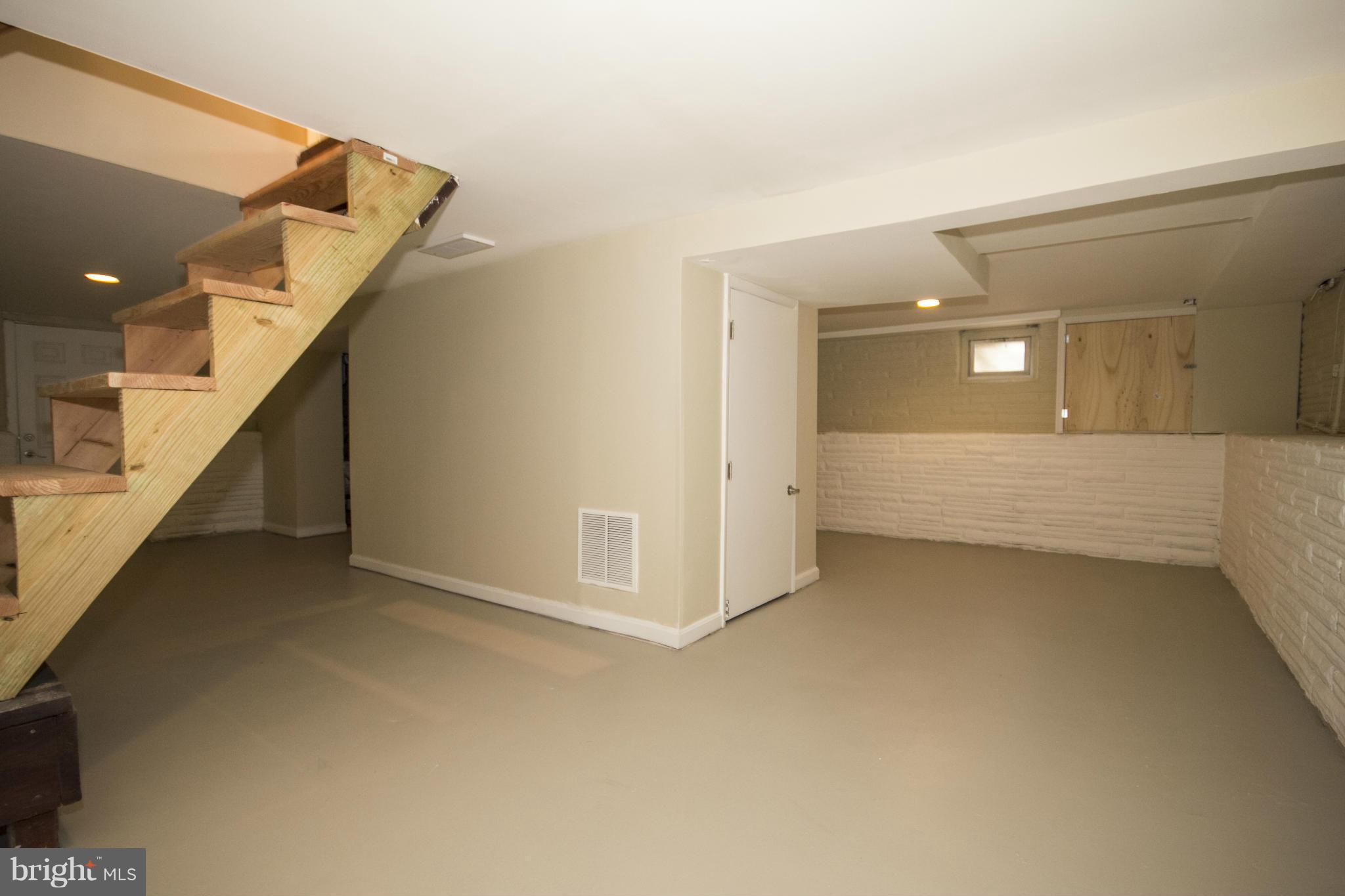 1220 Willow Road Baltimore, MD 21222 - Photo 19 of 23 a view of a hallway with staircase