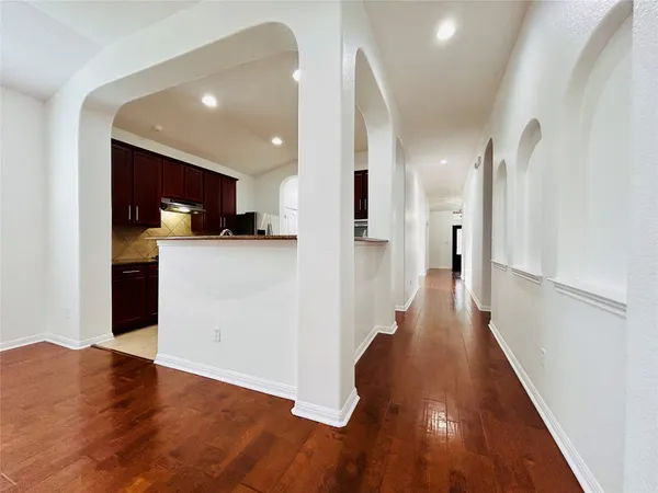 a view of a kitchen cabinets and wooden floor