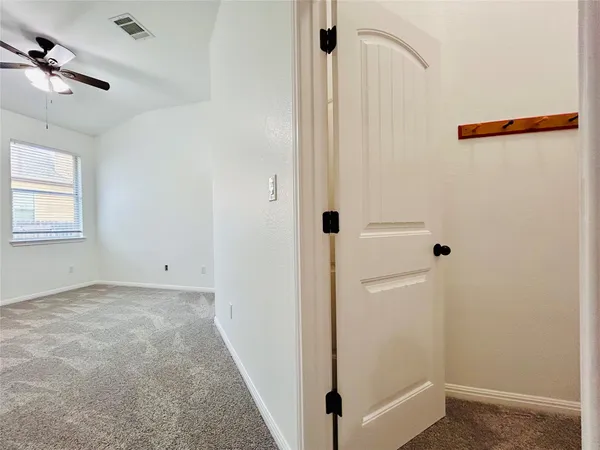 a view of a big room with carpet