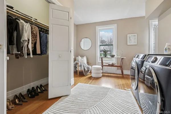a bedroom with furniture and a window