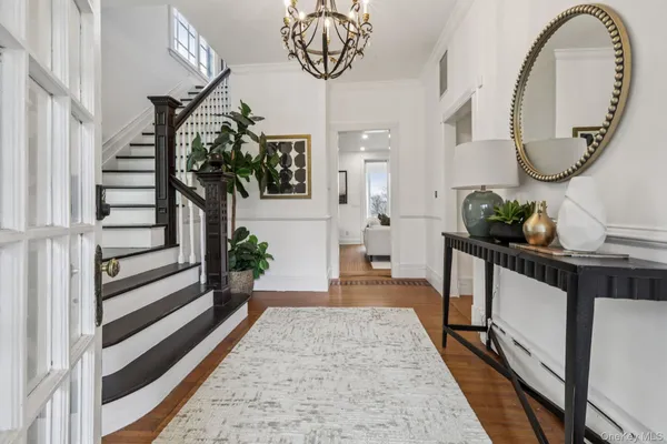 a view of living room kitchen and entryway
