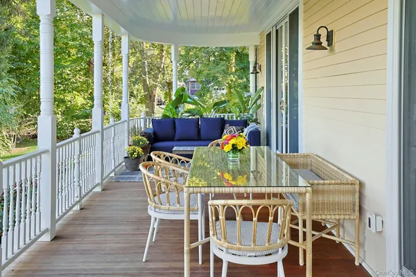 a view of balcony with furniture