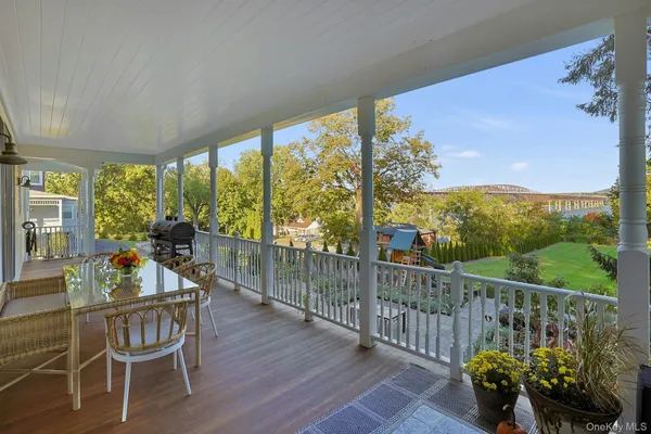 a view of a chairs and table in patio of the house