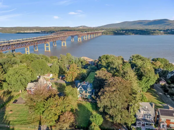 a view of a lake with houses in the back