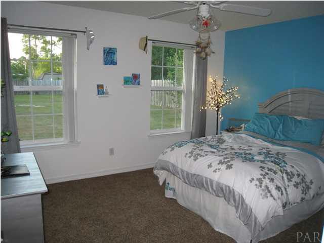 7570 Woodmont Road Navarre, FL 32566 - Photo 17 of 25 Bedroom 2 with lots of natural light and large closet
