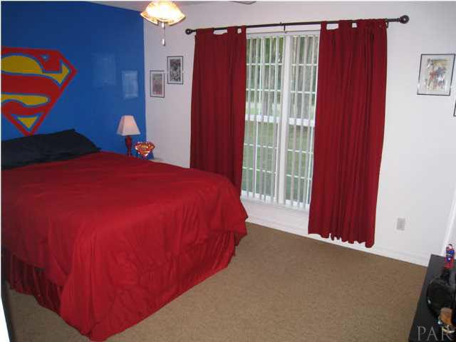 7570 Woodmont Road Navarre, FL 32566 - Photo 20 of 25 Bedroom 4 facing the front with large double window
