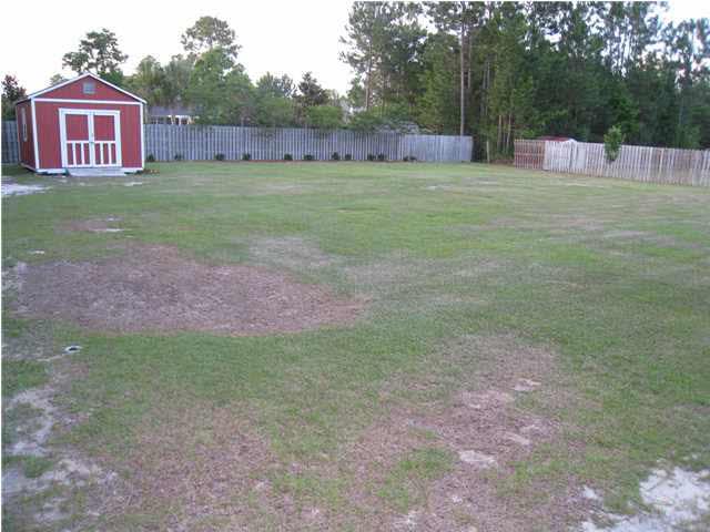 7570 Woodmont Road Navarre, FL 32566 - Photo 21 of 25 Huge 1/2 acre lot partially fenced on two sides.