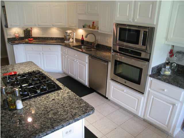 Beautiful kitchen with gas range and new stainless microwave and wall oven.