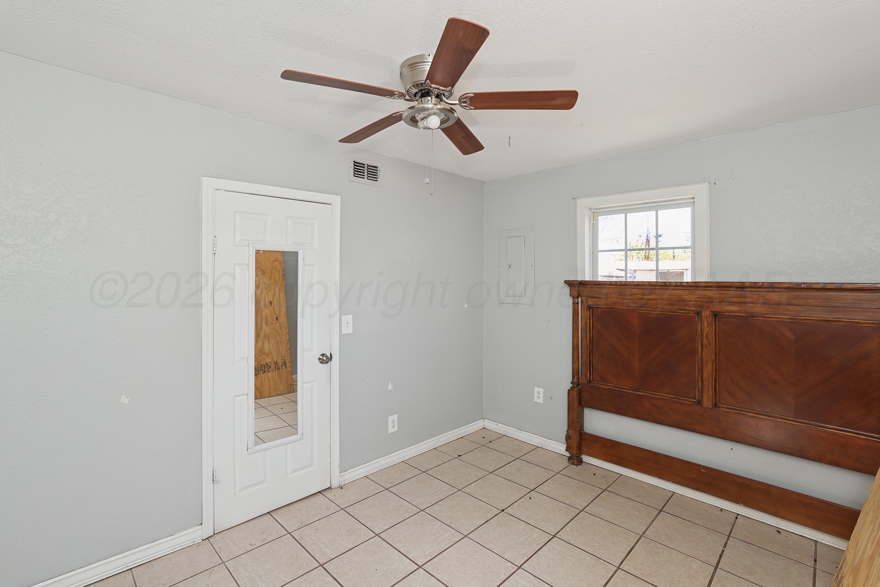 730 North Johnson Street Amarillo, TX 79107 - Photo 14 of 27 a view of an empty room with window and cabinet