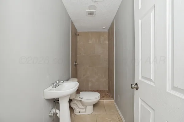 a view of a chandelier fan in the room