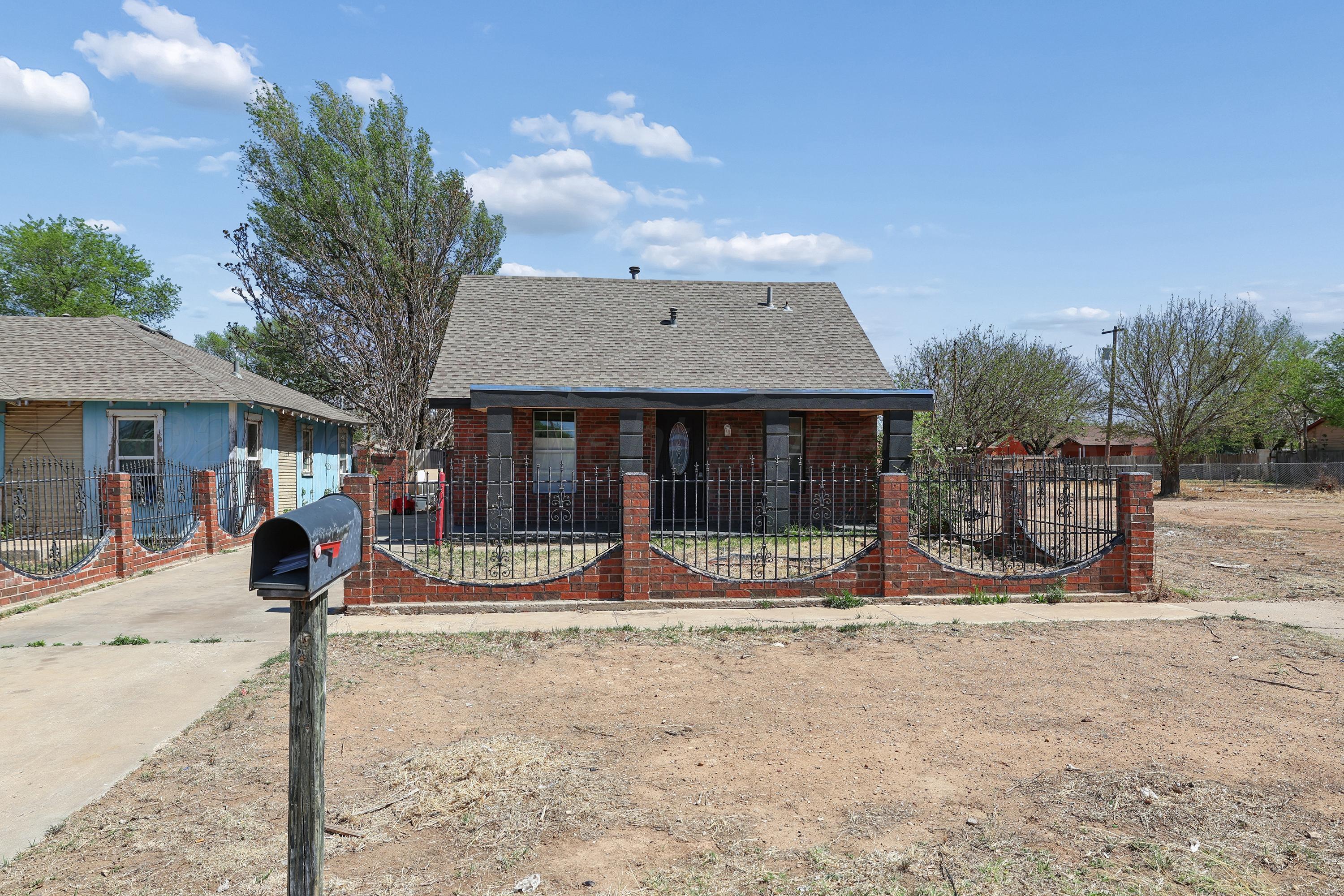 730 North Johnson Street Amarillo, TX 79107 - Photo 2 of 27 a view of a house with a yard covered in snow