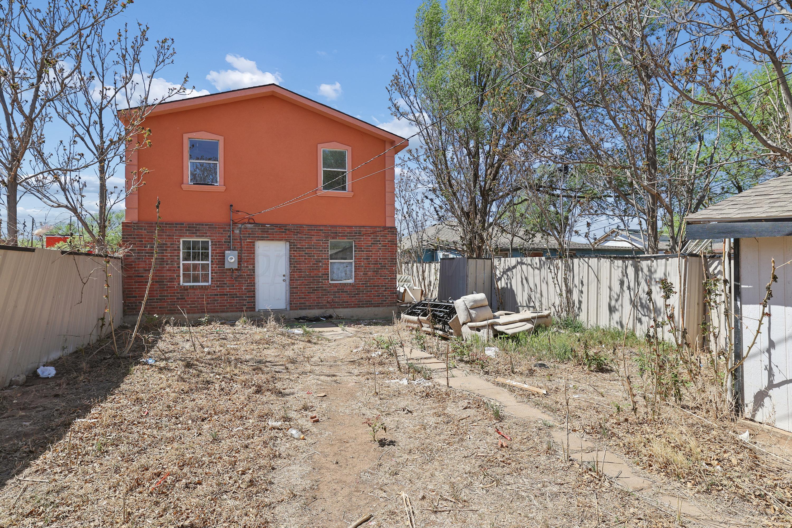 730 North Johnson Street Amarillo, TX 79107 - Photo 26 of 27 a backyard of a house with table and chairs