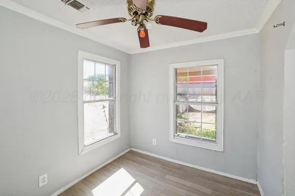 a view of an empty room with a window