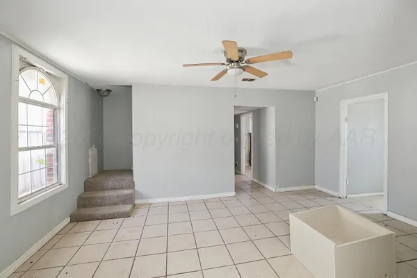 a view of an empty room and window
