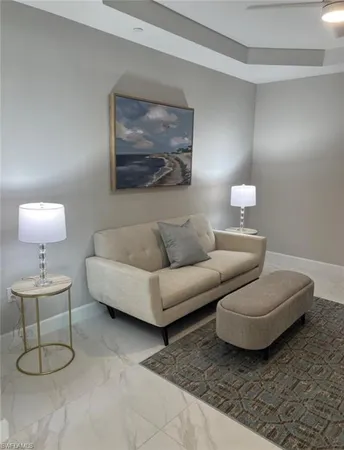 a living room with furniture and a table