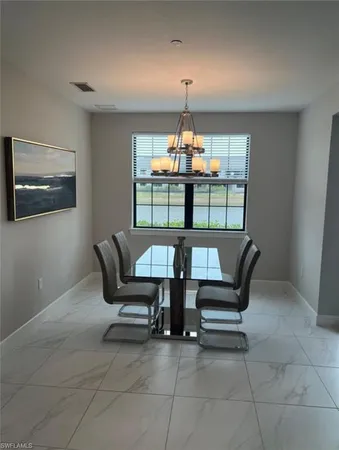 a living room with furniture and windows