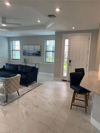 a view of a chairs and table in the balcony