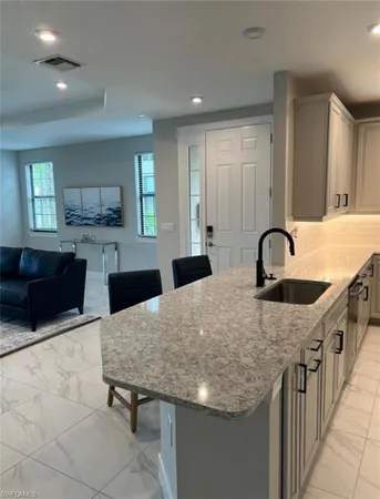 a kitchen with a stove and a sink