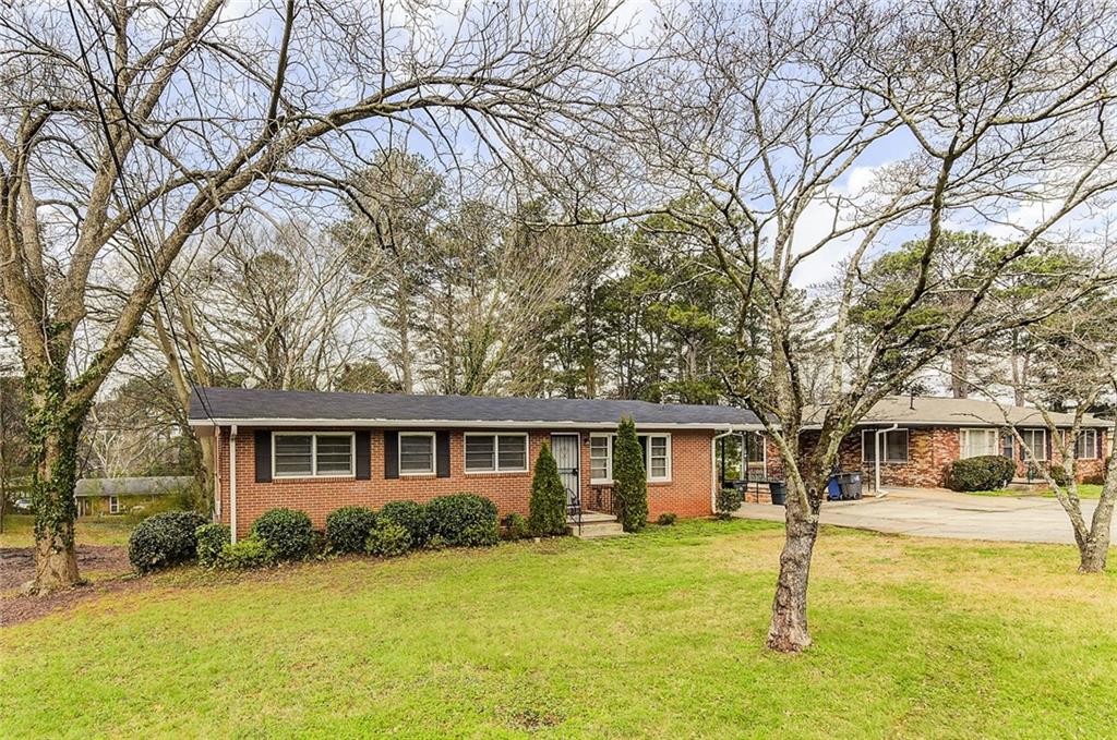 2890 Ben Hill Road East Point, GA 30344 - Photo 1 of 1 4 Sided Brick Ranch on full basement. Roof approximately 5yrs old with gutter guards.
