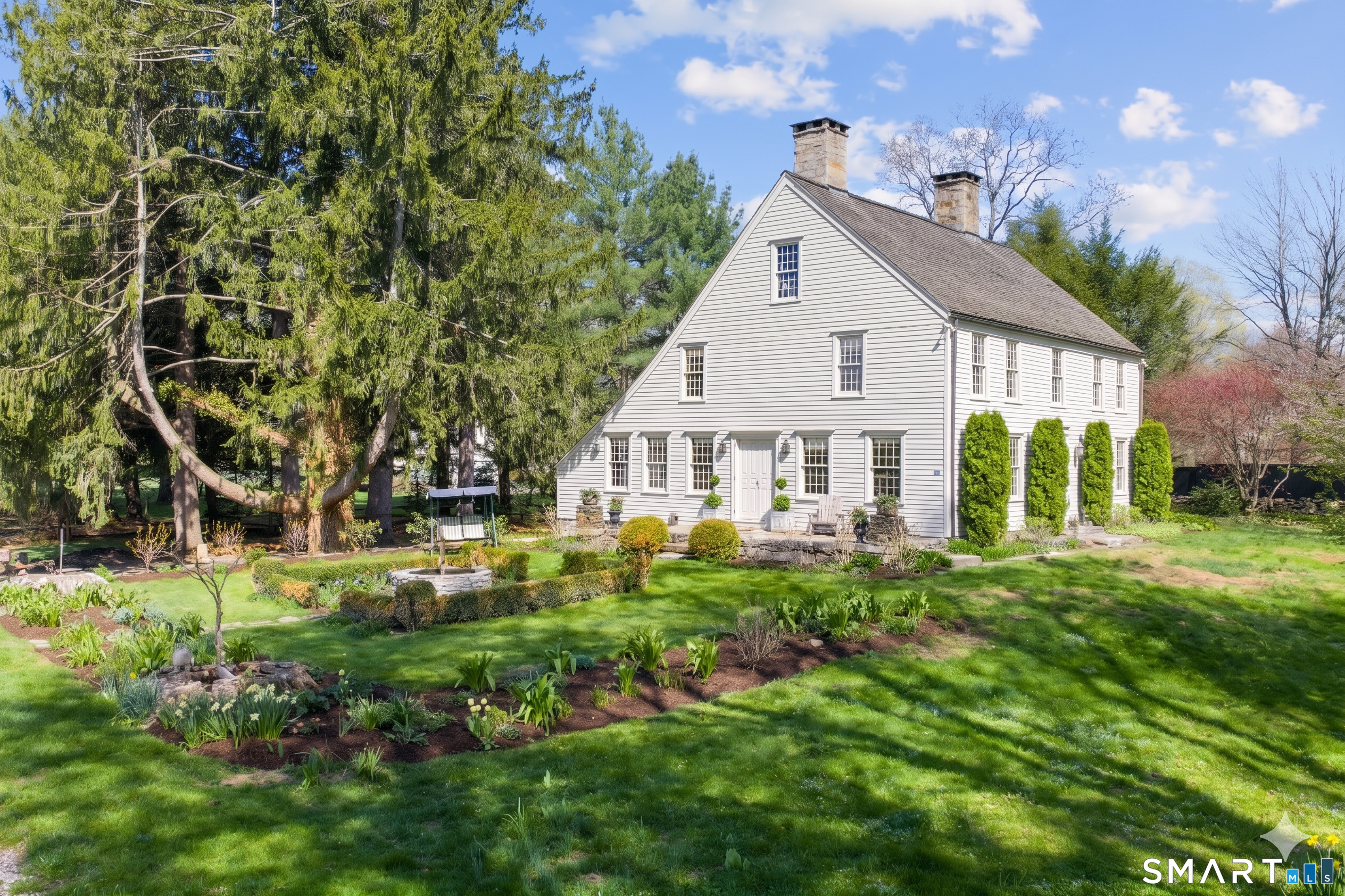 313 Umpawaug Road Redding, CT 06896 - Photo 4 of 40 a view of a house with big yard and plants