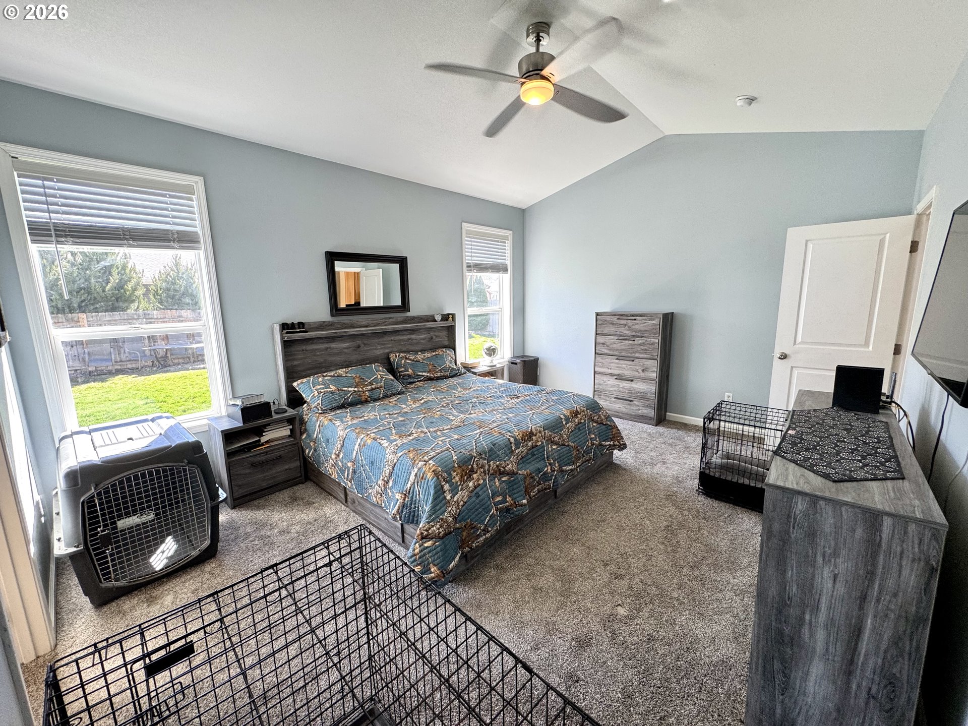 1105 G Street Baker City, OR 97814 - Photo 21 of 33 a bedroom with a bed a couch and a window