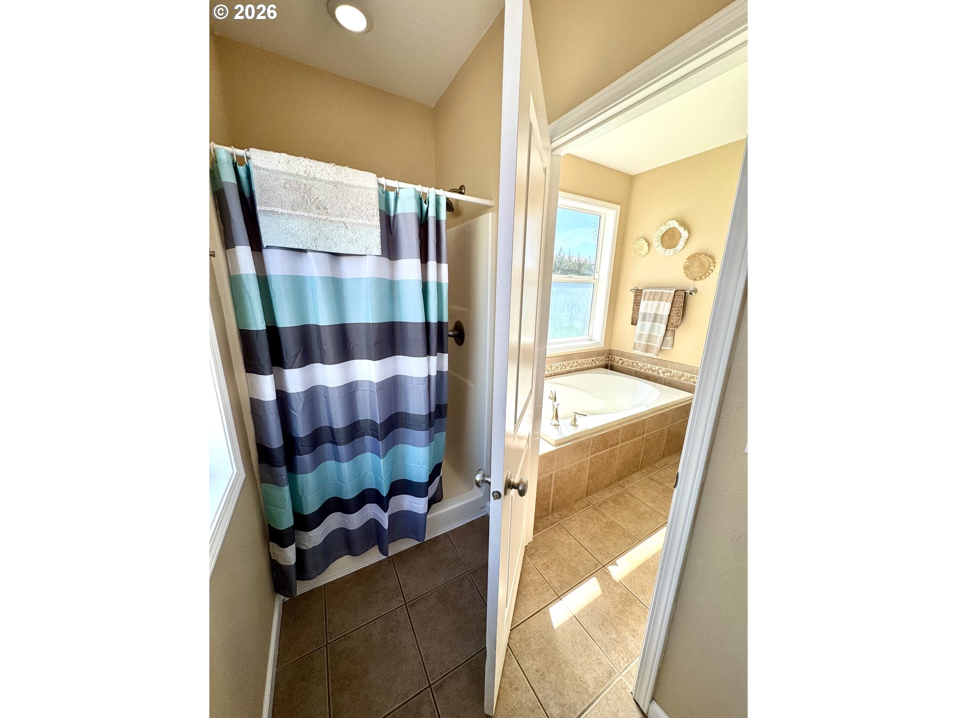1105 G Street Baker City, OR 97814 - Photo 24 of 33 a bathroom with a bathtub and shower