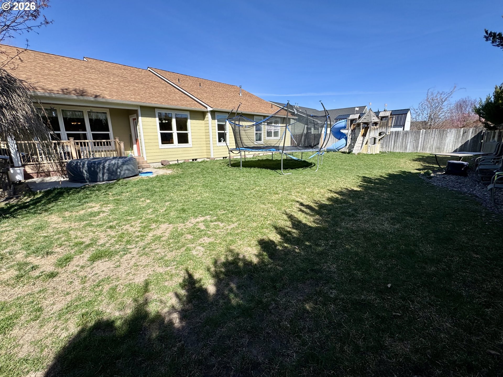 1105 G Street Baker City, OR 97814 - Photo 26 of 33 a view of a house with backyard and sitting area