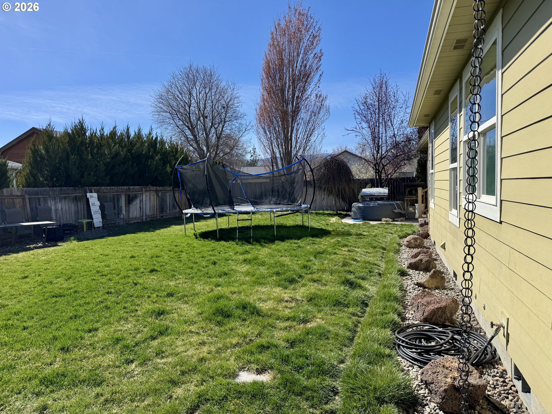 1105 G Street Baker City, OR 97814 - Photo 29 of 33 a backyard of a house with table and chairs