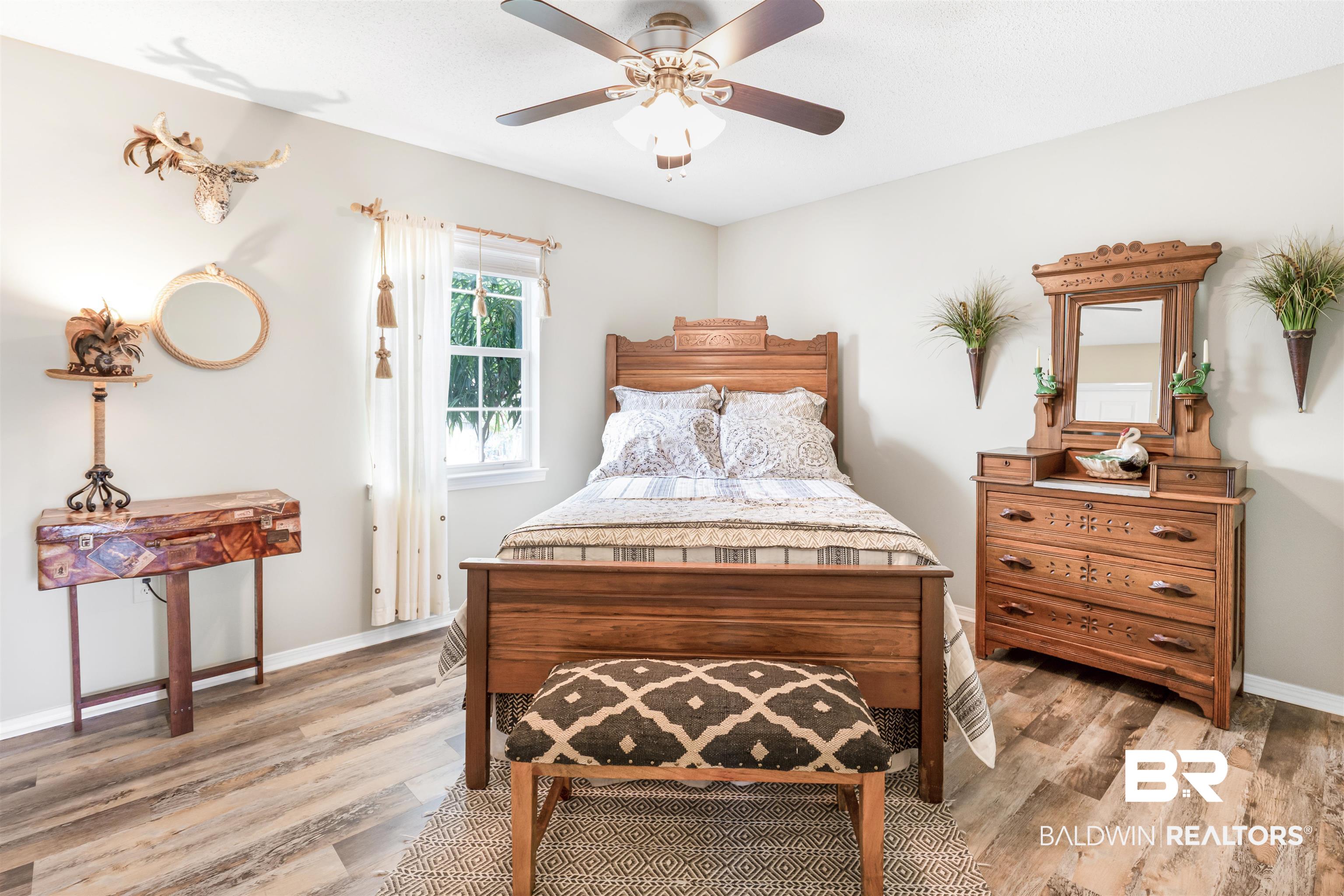 518 Ariel Avenue Foley, AL 36535 - Photo 26 of 47 Bedroom with light hardwood / wood-style flooring and ceiling fan