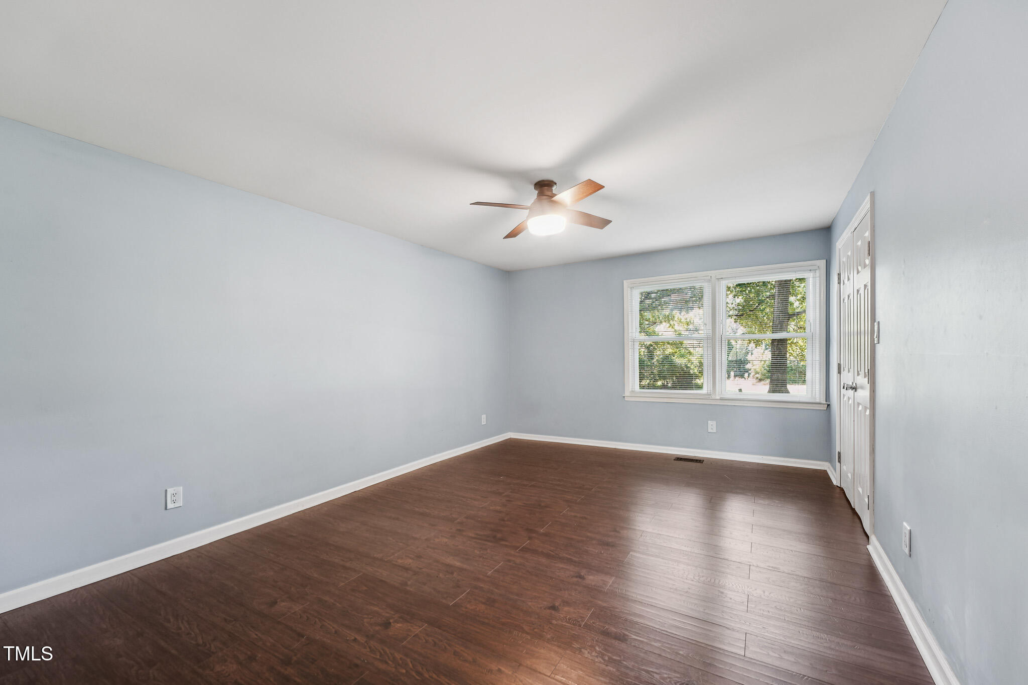 312 Mason Road Durham, NC 27712 - Photo 11 of 25 an empty room with wooden floor and window