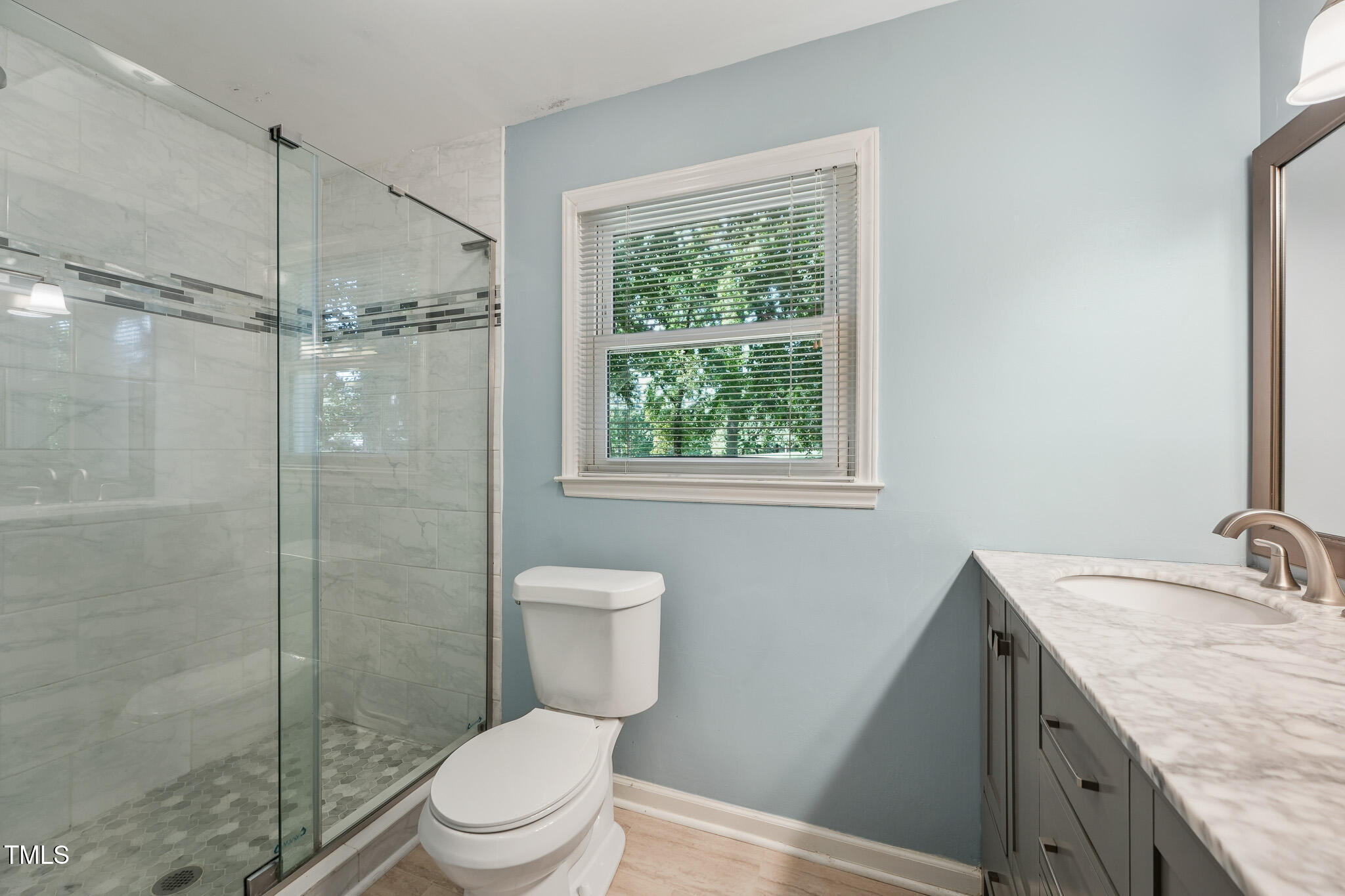 312 Mason Road Durham, NC 27712 - Photo 14 of 25 a bathroom with a granite countertop sink toilet and shower