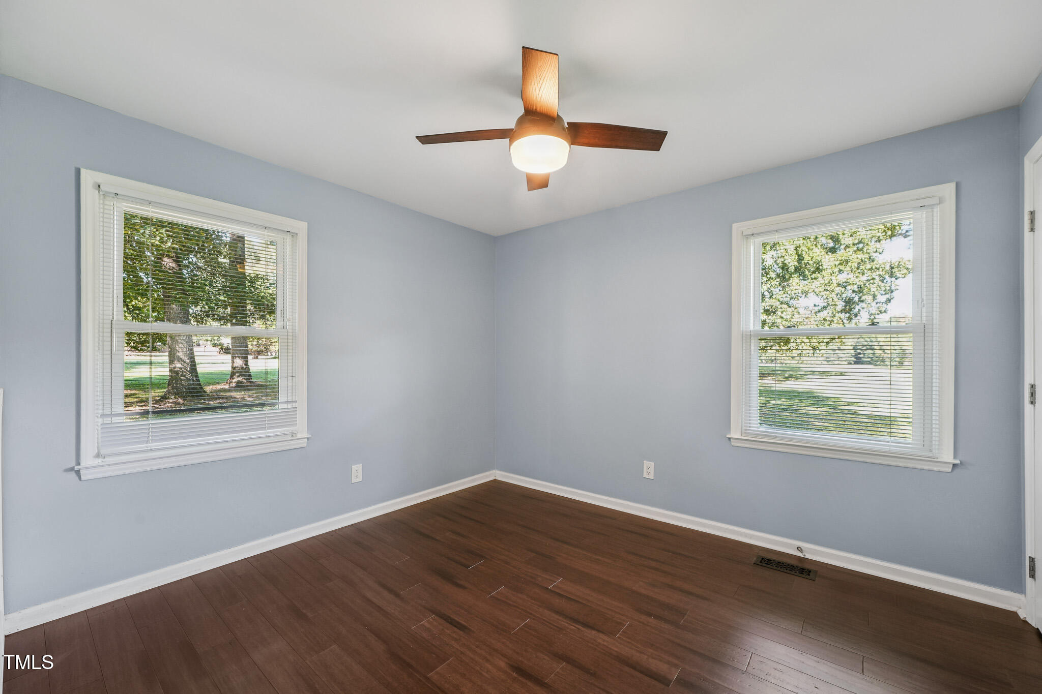 312 Mason Road Durham, NC 27712 - Photo 16 of 25 a view of an empty room with wooden floor and a window