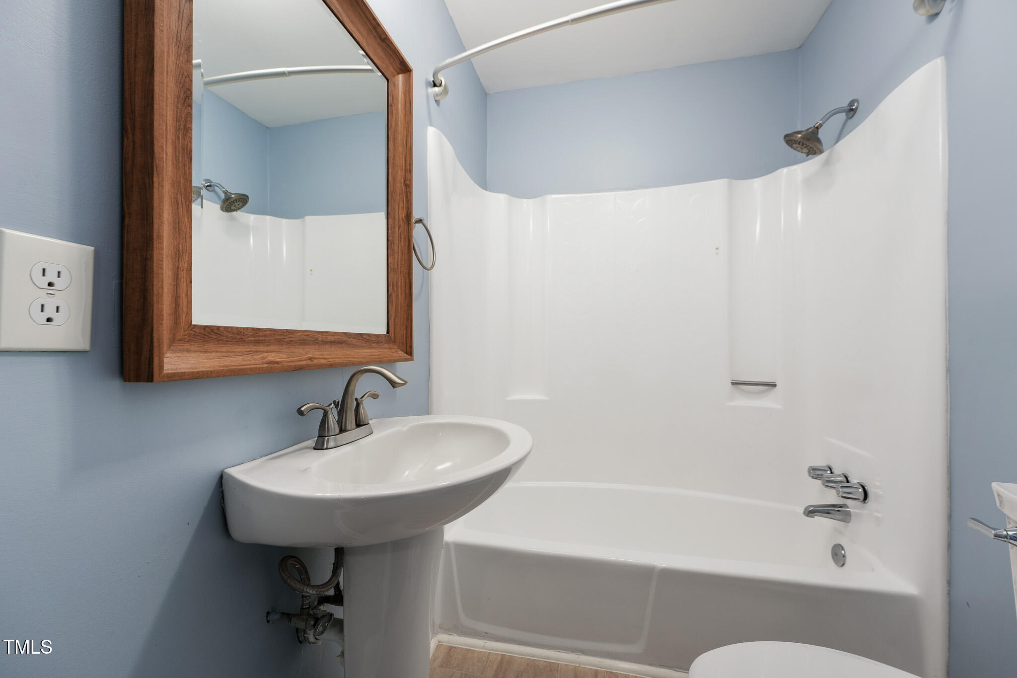 312 Mason Road Durham, NC 27712 - Photo 18 of 25 a bathroom with a sink and a mirror
