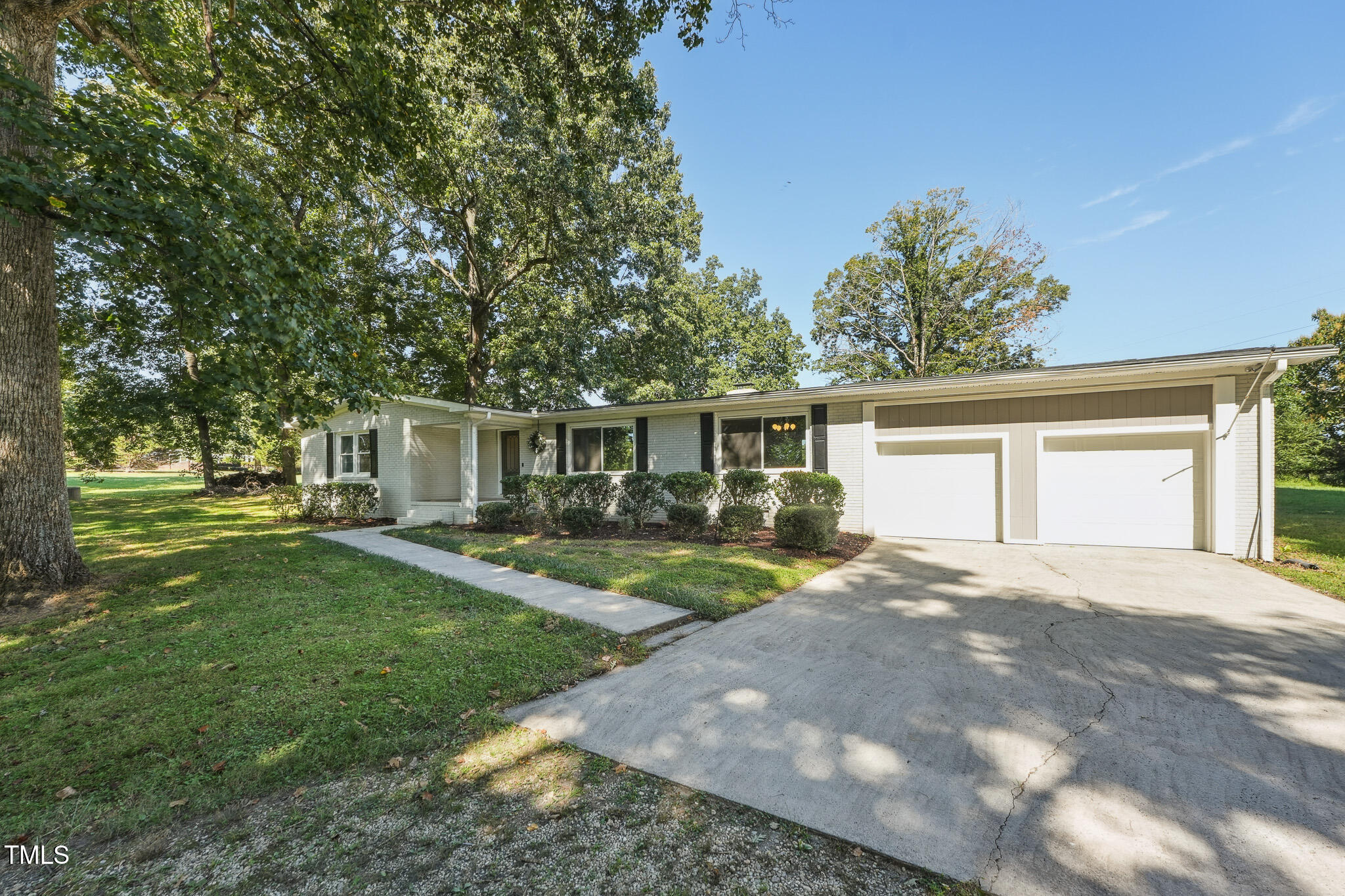 312 Mason Road Durham, NC 27712 - Photo 20 of 25 a front view of a house with yard and green space