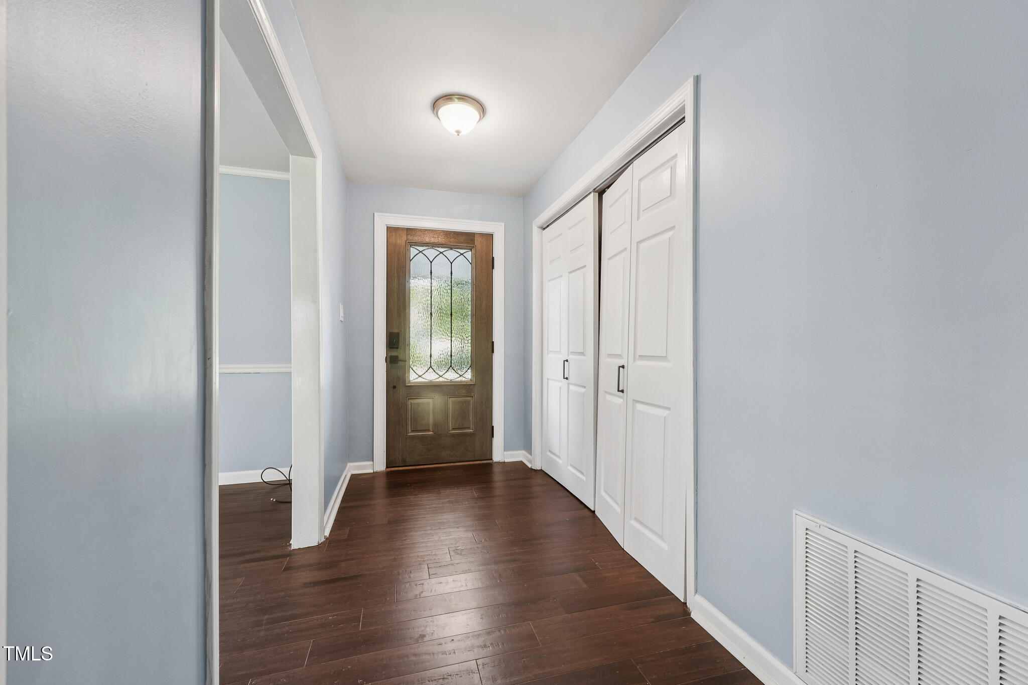 312 Mason Road Durham, NC 27712 - Photo 5 of 25 a view of a hallway with wooden floor