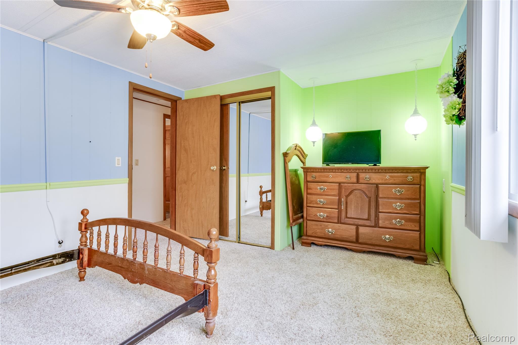 3333 Ravenswood Road Marysville, MI 48040 - Photo 16 of 25 Bedroom featuring light carpet, ceiling fan, and a closet