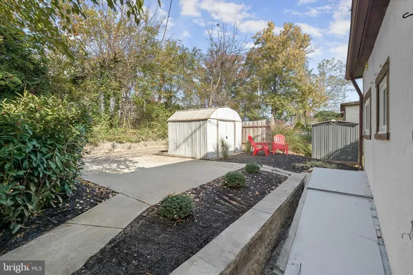 a front view of a house with outdoor seating