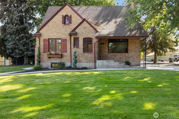 a front view of house with yard and green space
