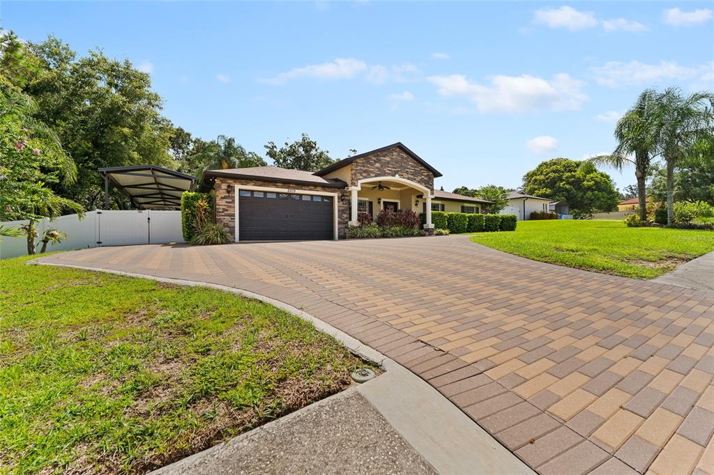 2209 High Point Drive Brandon, FL 33511 - Photo 1 of 1 a front view of a house with garden