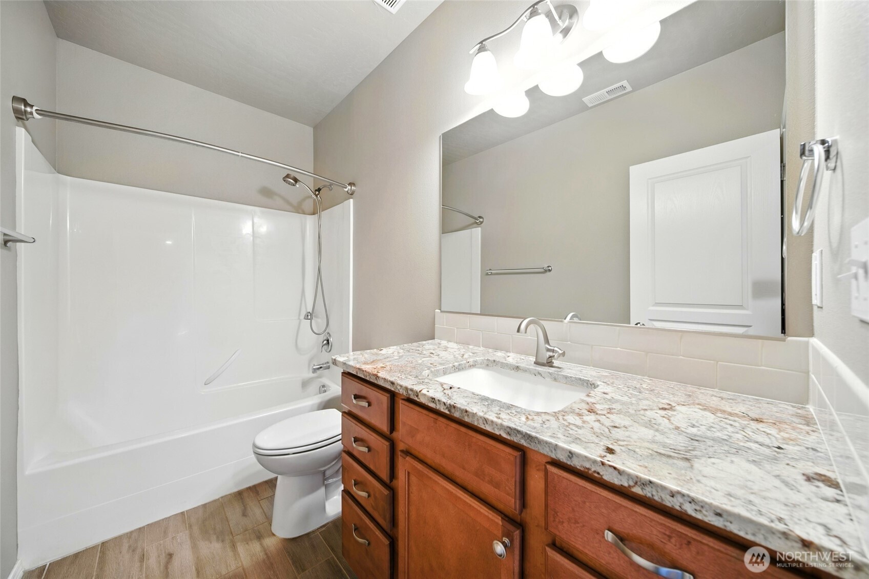 110 Shane Porter Road Walla Walla, WA 99362 - Photo 19 of 40 a bathroom with a granite countertop sink toilet and shower
