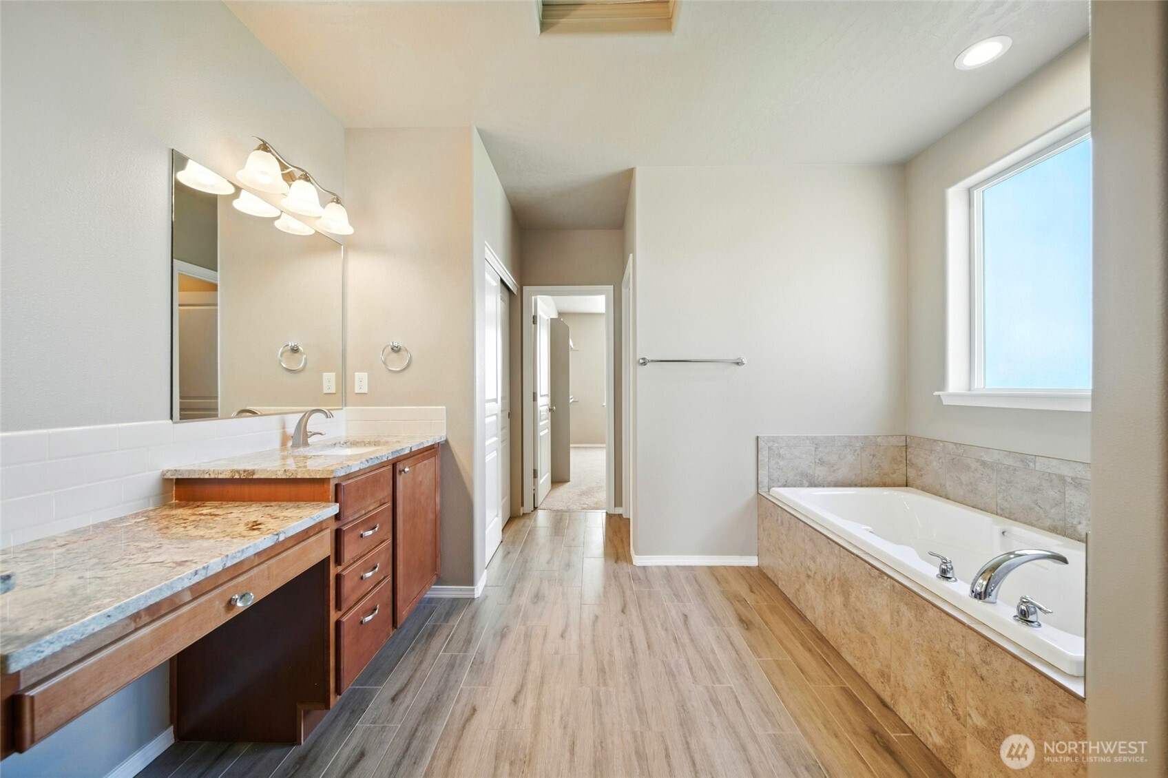 110 Shane Porter Road Walla Walla, WA 99362 - Photo 23 of 40 a bathroom with a granite countertop tub sink and mirror