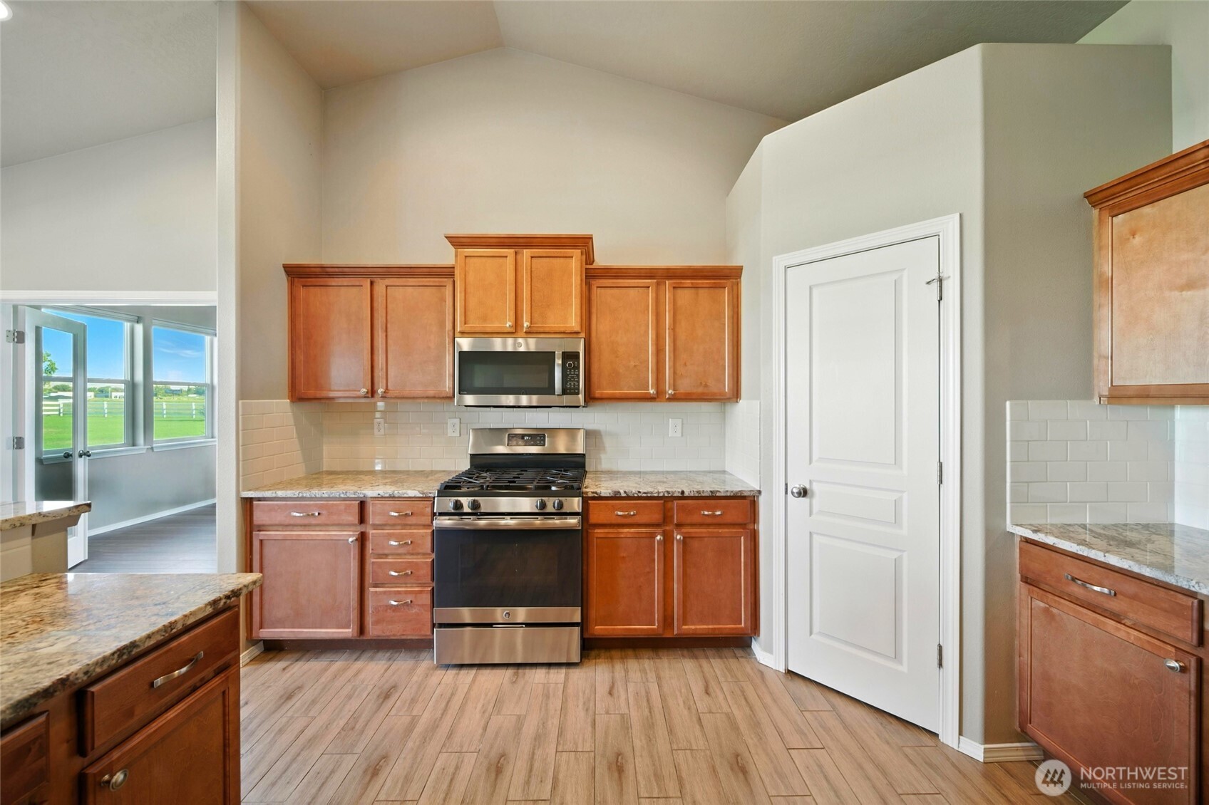 110 Shane Porter Road Walla Walla, WA 99362 - Photo 8 of 40 a kitchen with stainless steel appliances granite countertop a stove a sink and a refrigerator