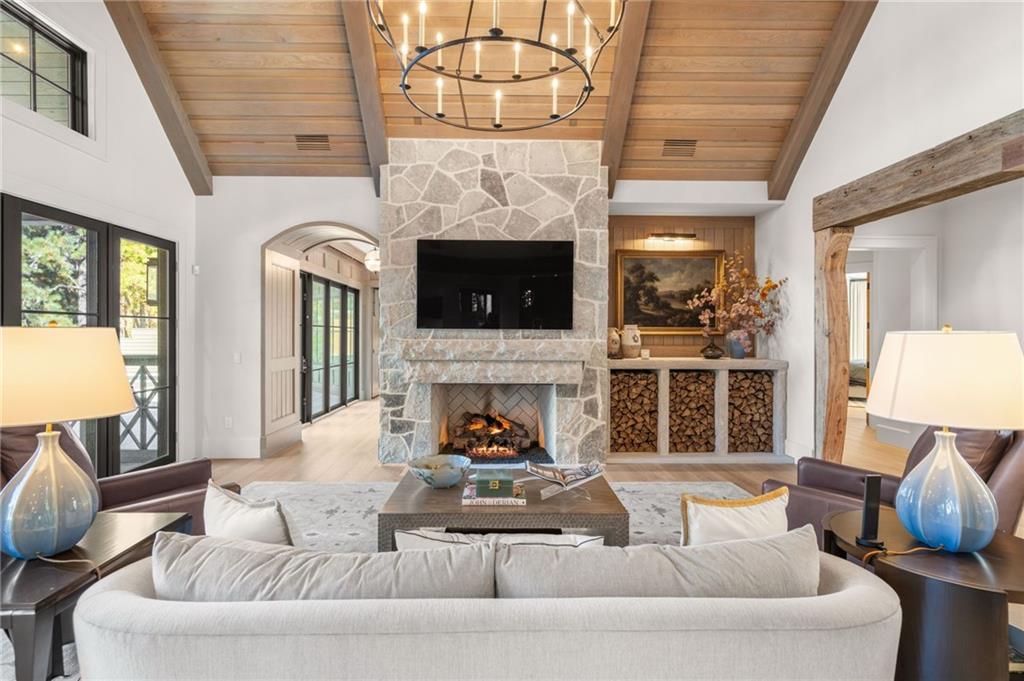 6091 GC Crow Road Flowery Branch, GA 30542 - Photo 13 of 100 a living room with furniture and a fireplace
