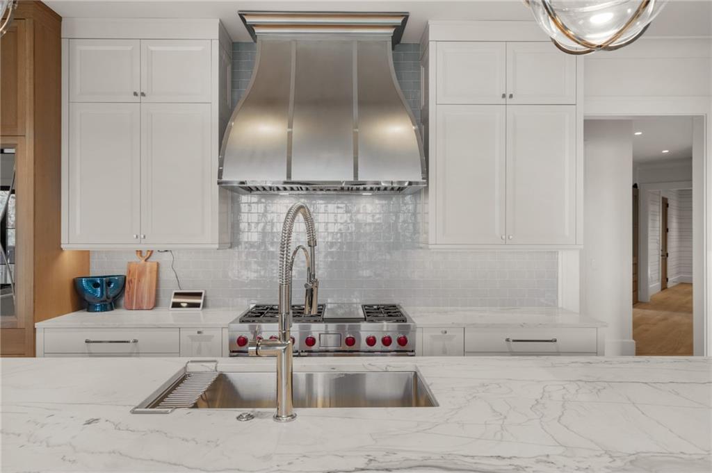 6091 GC Crow Road Flowery Branch, GA 30542 - Photo 15 of 100 a kitchen with a sink and cabinets