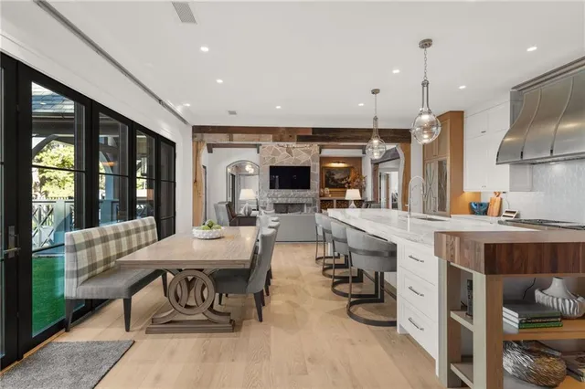 a living room with furniture flat screen tv and a fireplace